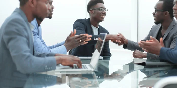 happy-business-people-shaking-hands-office-meeting-concept-partnership